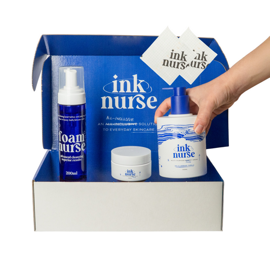 Ink nurse skincare product set with a hand holding a bottle against a white background, showcasing australia's best tattoo aftercare product range.